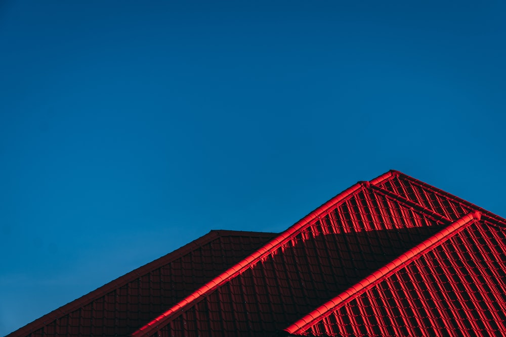A red roof against a blue sky